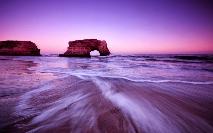 Natural Bridges State Beach at sunset