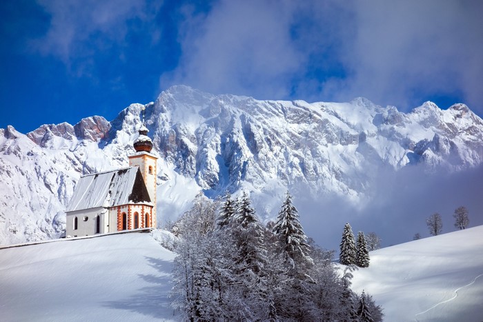 Winter church in snowy mountains