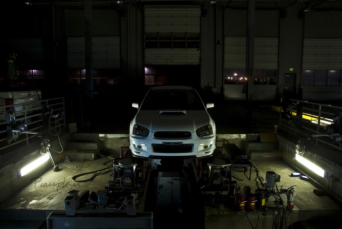 White Subaru Impreza WRX STi in a garage