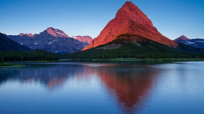 Sunrise over Swiftcurrent Lake with Mountains in Glacier National Park