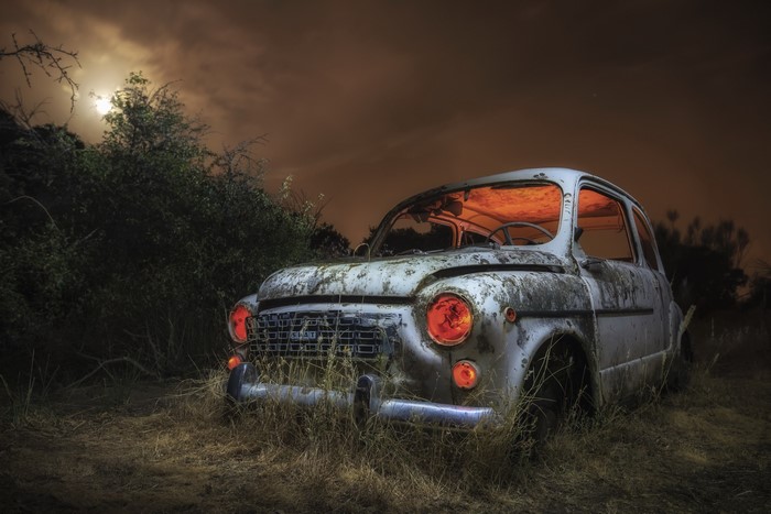 Abandoned Fiat 600 at night