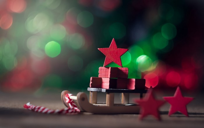 Christmas Sleigh with Red Stars and Bokeh Lights