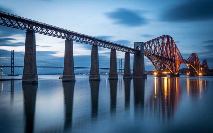 Forth Railway Bridge over water at dusk