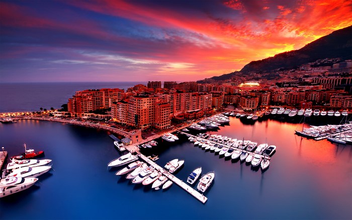 Monaco cityscape at sunset with harbor and yachts