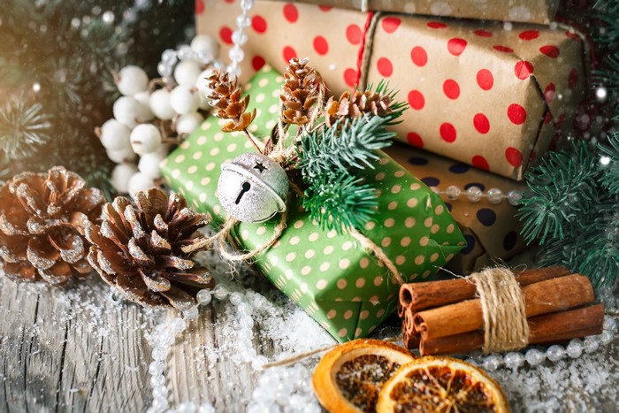 Christmas presents with pine cones and cinnamon sticks