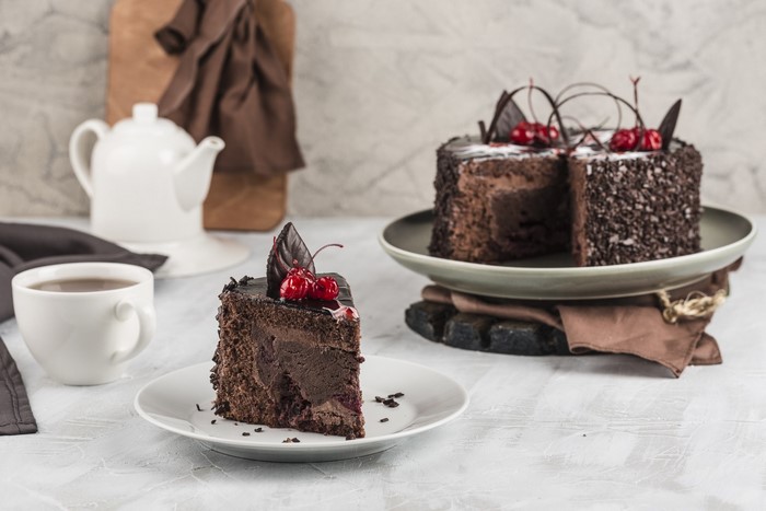 Chocolate cake with cherries and coffee