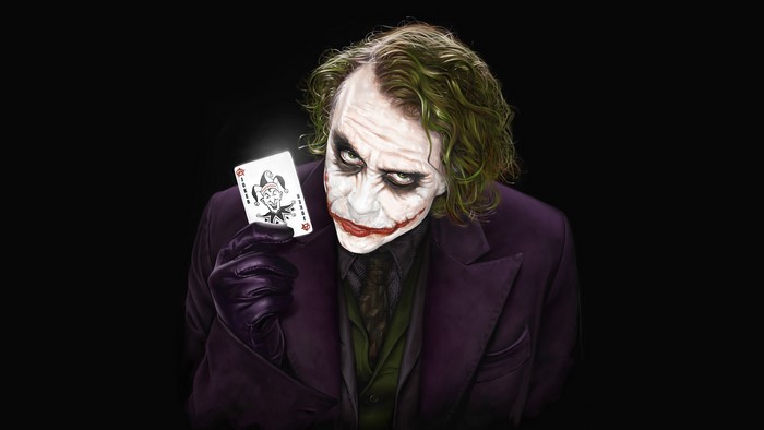 The Joker holding a playing card
