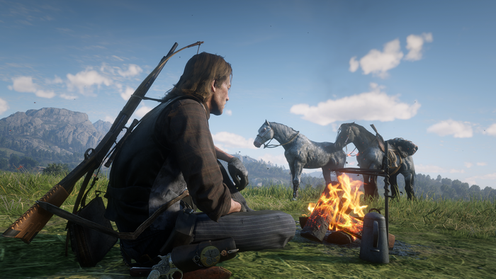 Arthur Morgan from Red Dead Redemption 2 by a campfire with horses