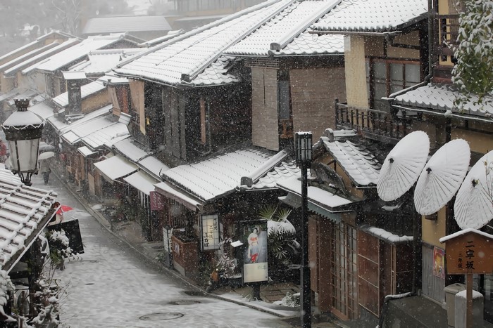 Kyoto street in winter with snow falling