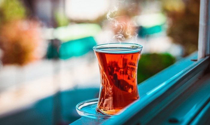 Hot tea in a glass on a windowsill