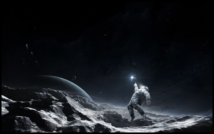 Astronaut reaching for a glowing planet in space