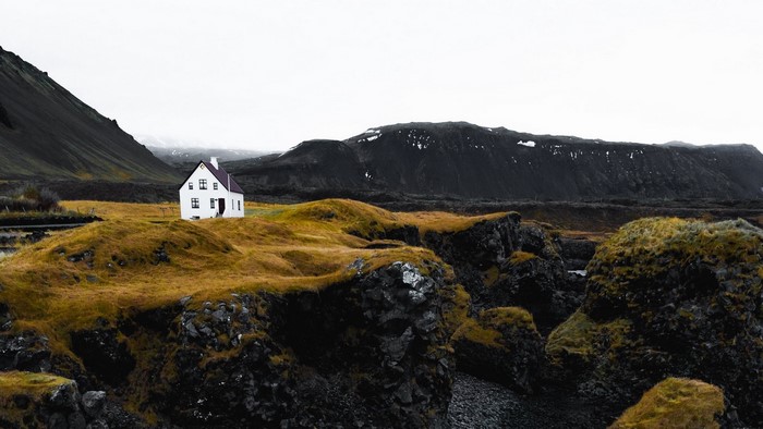 White house on a rocky hill in Iceland