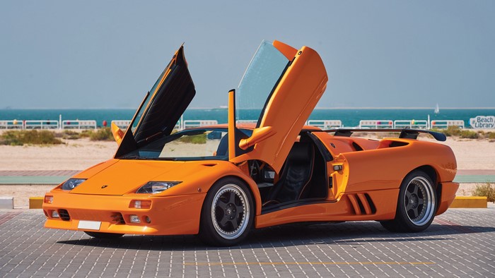 Orange Lamborghini Diablo Roadster with Scissor Doors