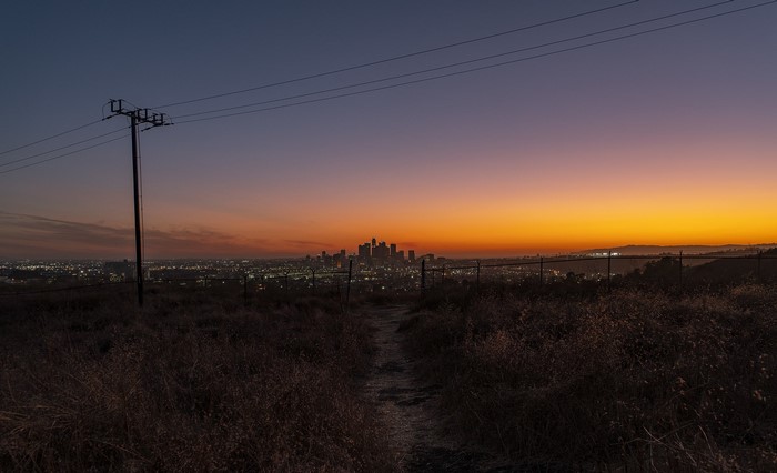 Los Angeles cityscape at dusk with power lines