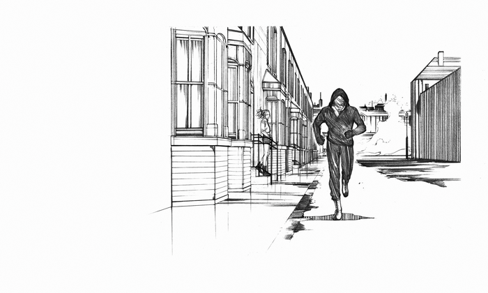 Man in hoodie running down street