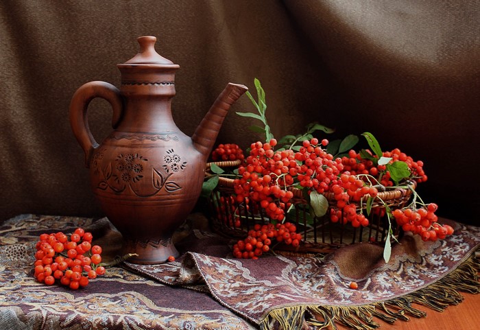 Still life with clay pitcher and rowan berries