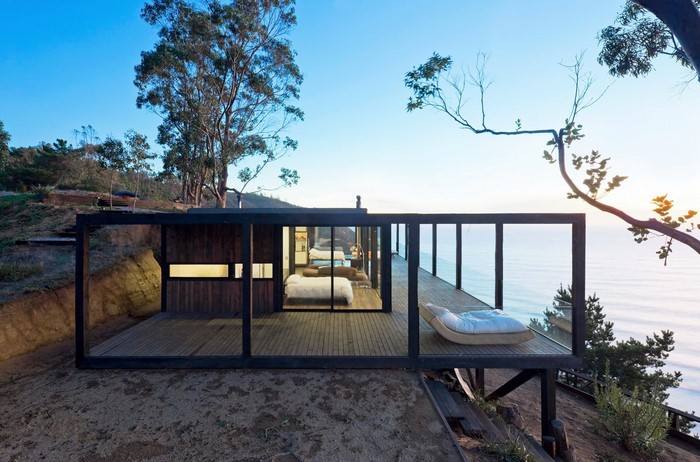 Modern house on a cliff overlooking the ocean