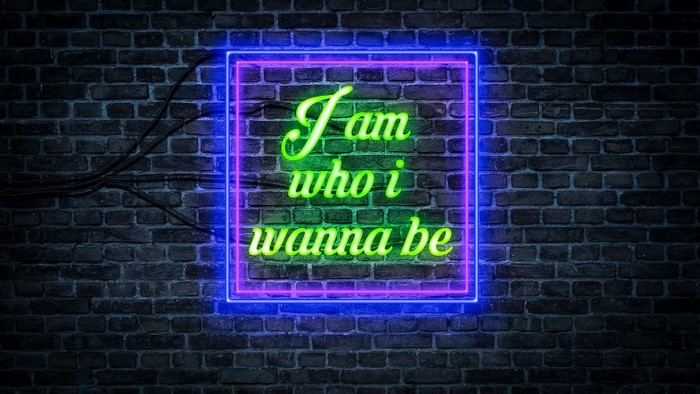 Neon sign on brick wall