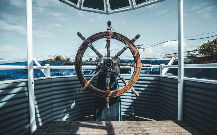 Ship's steering wheel on a deck