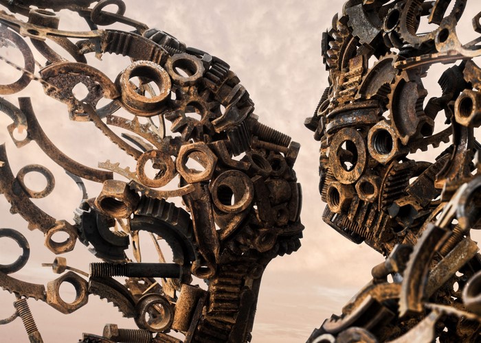 Sculpture of two faces made of metal parts
