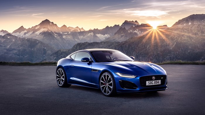 Blue Jaguar F-Type Coupe in Mountains at Sunset