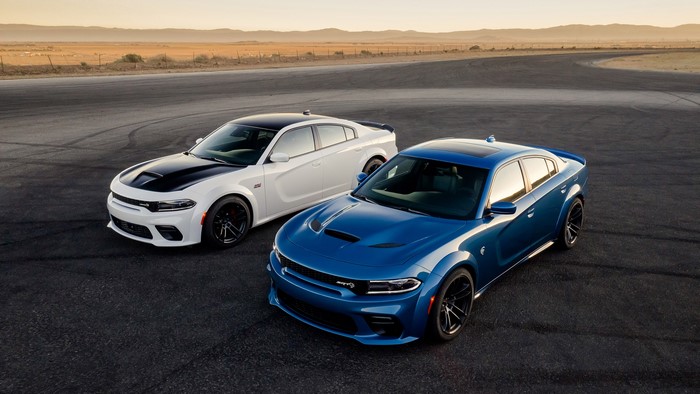 Two Dodge Charger SRT Hellcat cars on a track