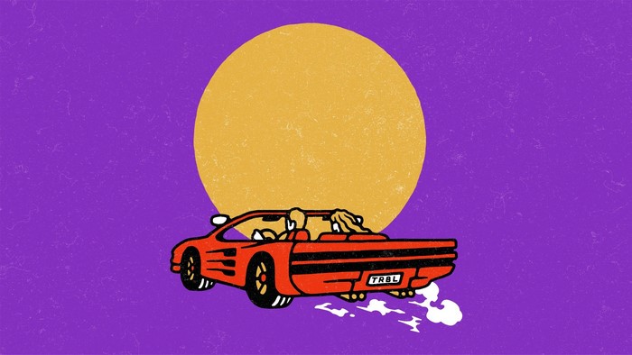 Red convertible car with two people driving under a large yellow circle