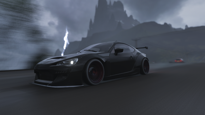 Black Subaru BRZ drifting in Forza Horizon 4 during a storm