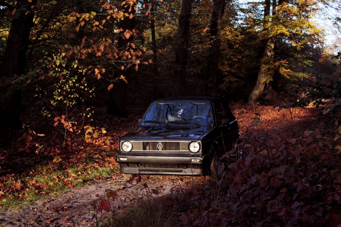 Black Volkswagen Golf Mk1 in Autumn Forest