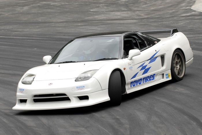 White Honda NSX mk1 drifting on a track