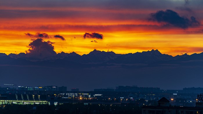 Sunset over mountains and city in Sichuan