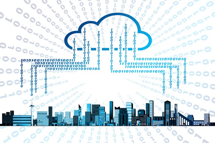 Cloud services and cityscape with binary code