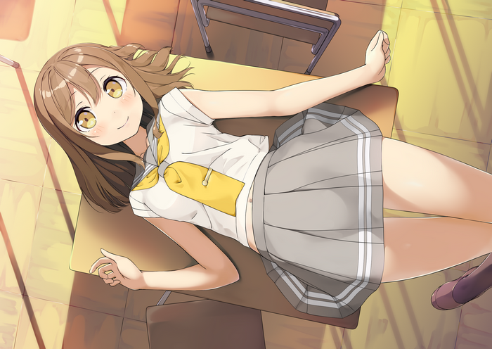 Girl in school uniform lying on a desk