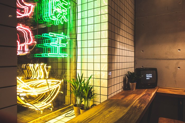 Neon signs and CRT TV in a restaurant