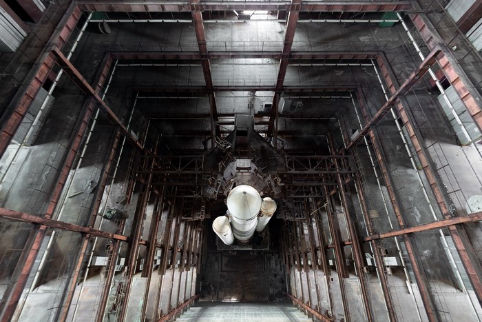 Abandoned rocket hangar with large rocket
