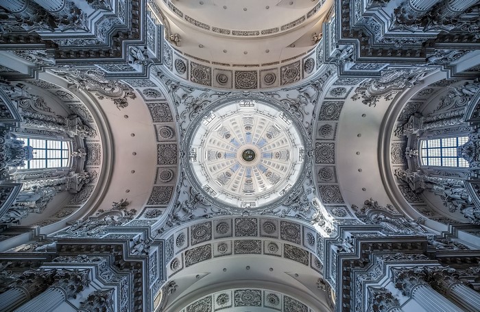 The interior dome and ceiling of a Baroque church in Munich, Germany