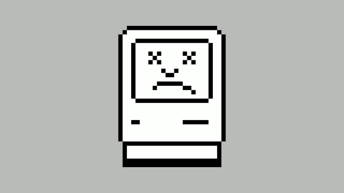 Pixelated Macintosh computer with a sad face
