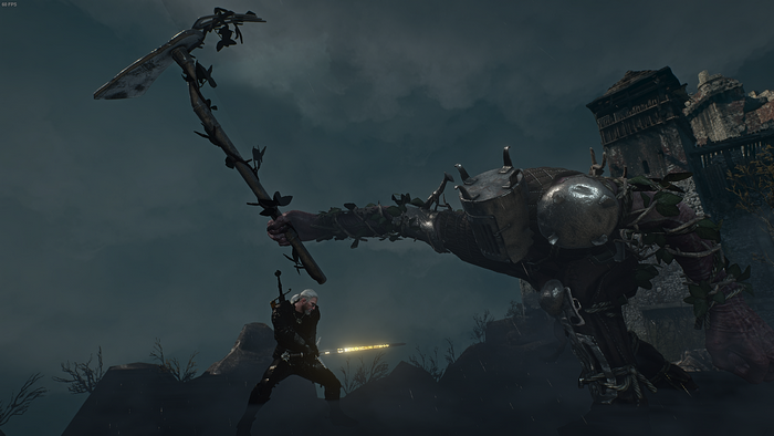 Geralt of Rivia fighting a monster in ruins