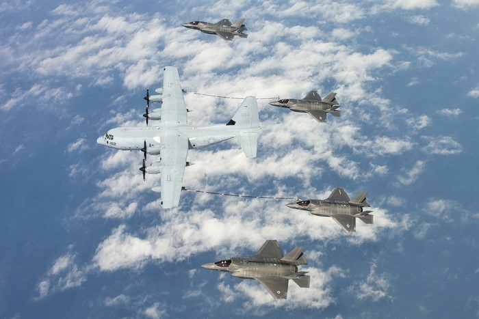 US Air Force F-35s refuel from C-130 Hercules aircraft
