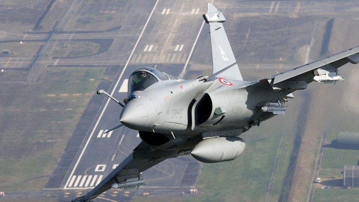 Dassault Rafale military aircraft flying over runway