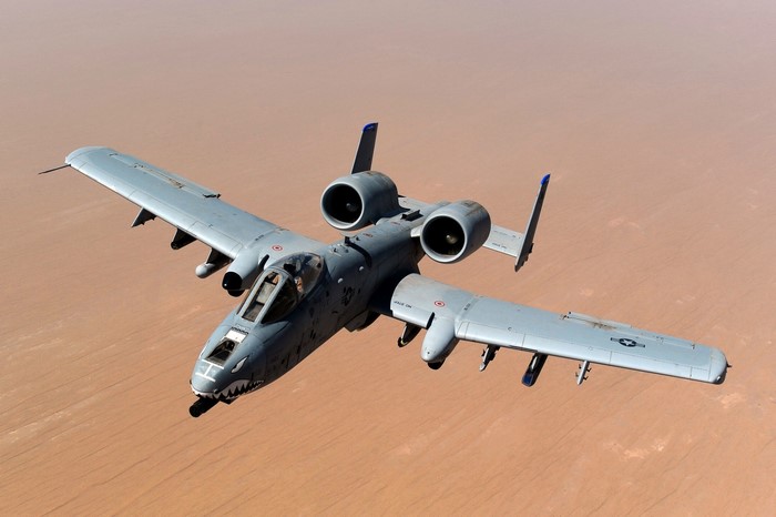 A-10 Thunderbolt II aircraft flying over desert