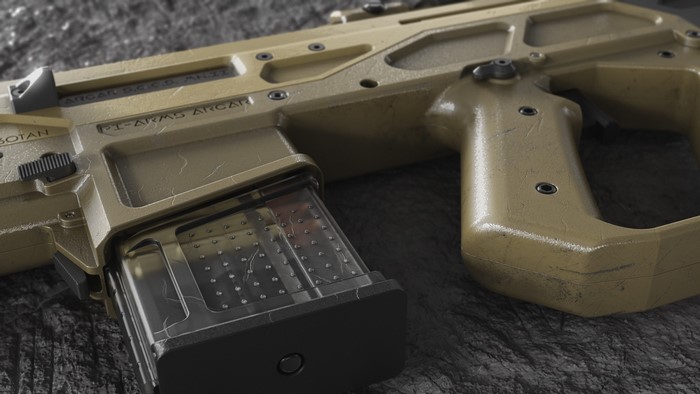Close-up of a tan assault rifle with a clear magazine