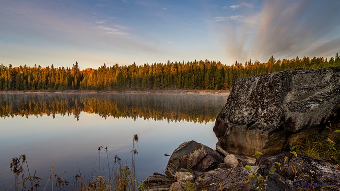 4K Sunrise Reflection Over Ontario Lake with Forest and Rocks