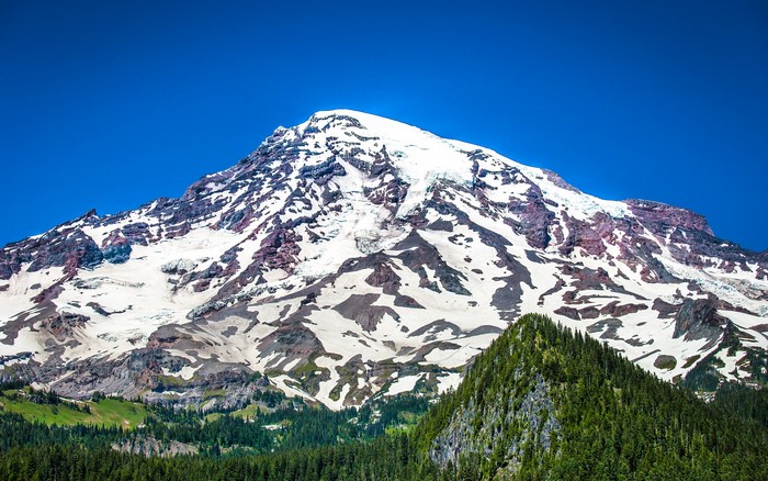 Snow-capped mountain range under a clear blue sky