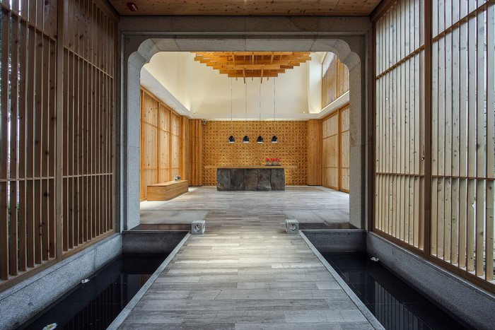 Interior of a modern spa with wooden accents and water features