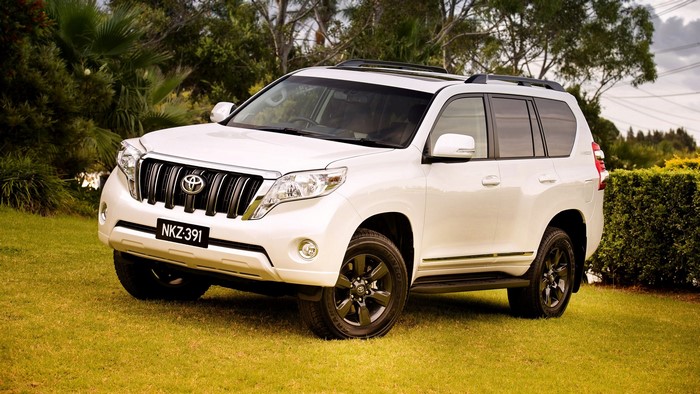 White Toyota Land Cruiser Prado on grass