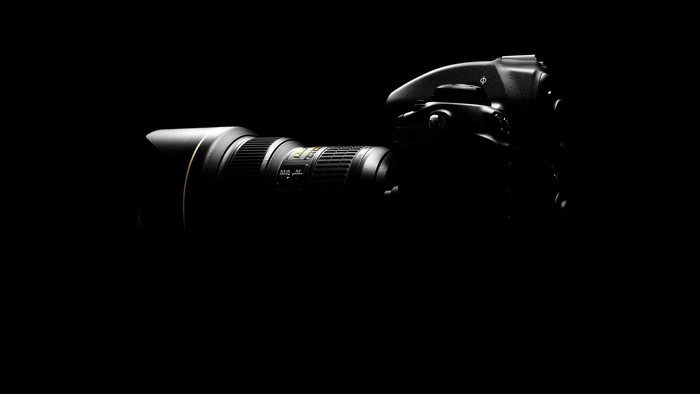 Nikon camera with lens in dark lighting
