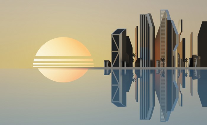 Modern city skyline at sunset with reflection