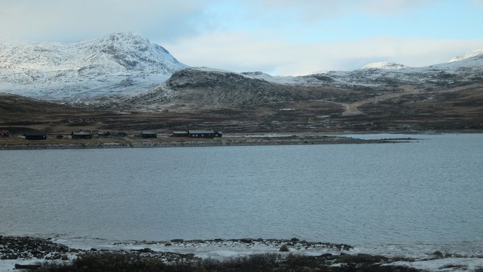 Snow-capped mountains and a lake in Norway