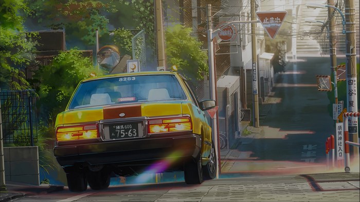 Yellow taxi driving down a Japanese street